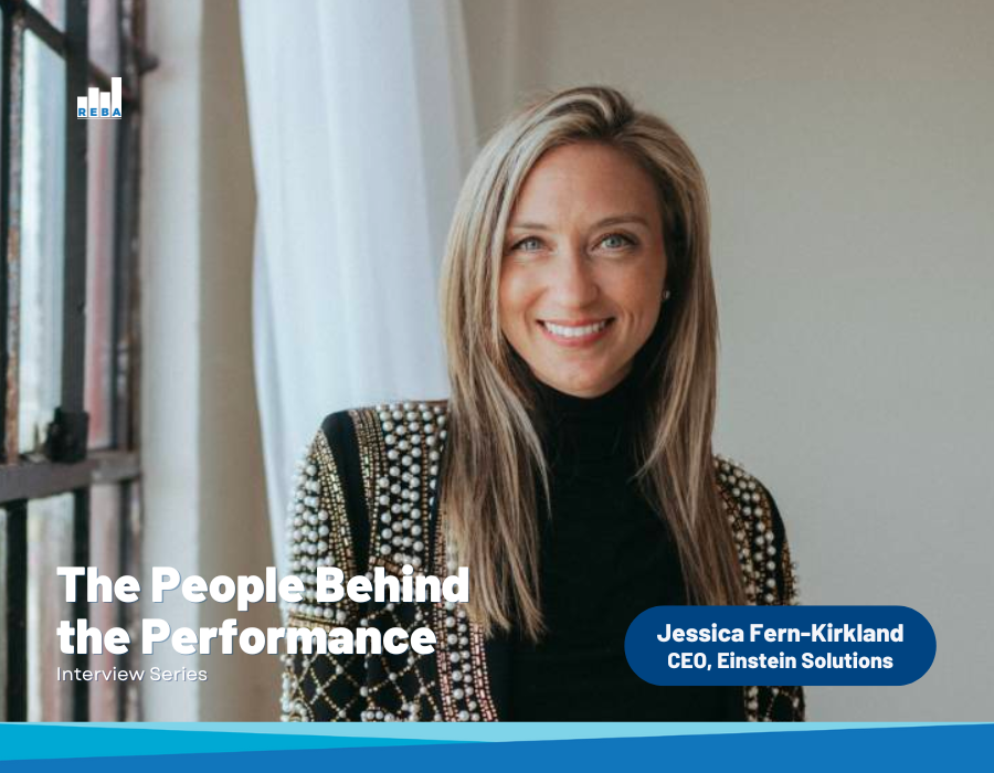 A woman with long blonde hair in a black top and studded jacket smiles at the camera. Text reads: “The People Behind the Performance: Interview Series,” and identifies her as Jessica Fern-Kirkland, CEO, Einstein Solutions.