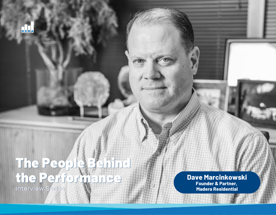 A man sits at a desk in an office, looking at the camera. Text reads The People Behind the Performance Interview Series and Dave Marcinkowski, Founder & Partner, Madera Residential.