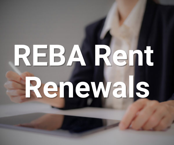 A person in business attire sits at a desk with a tablet, holding a stylus. The text REBA Rent Renewals appears prominently over the image.
