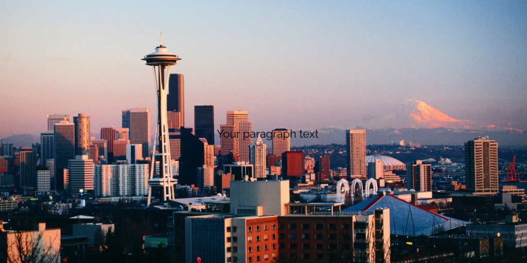Seattle skyline at sunset with the Space Needle in the foreground and Mount Rainier in the background, under a clear sky.